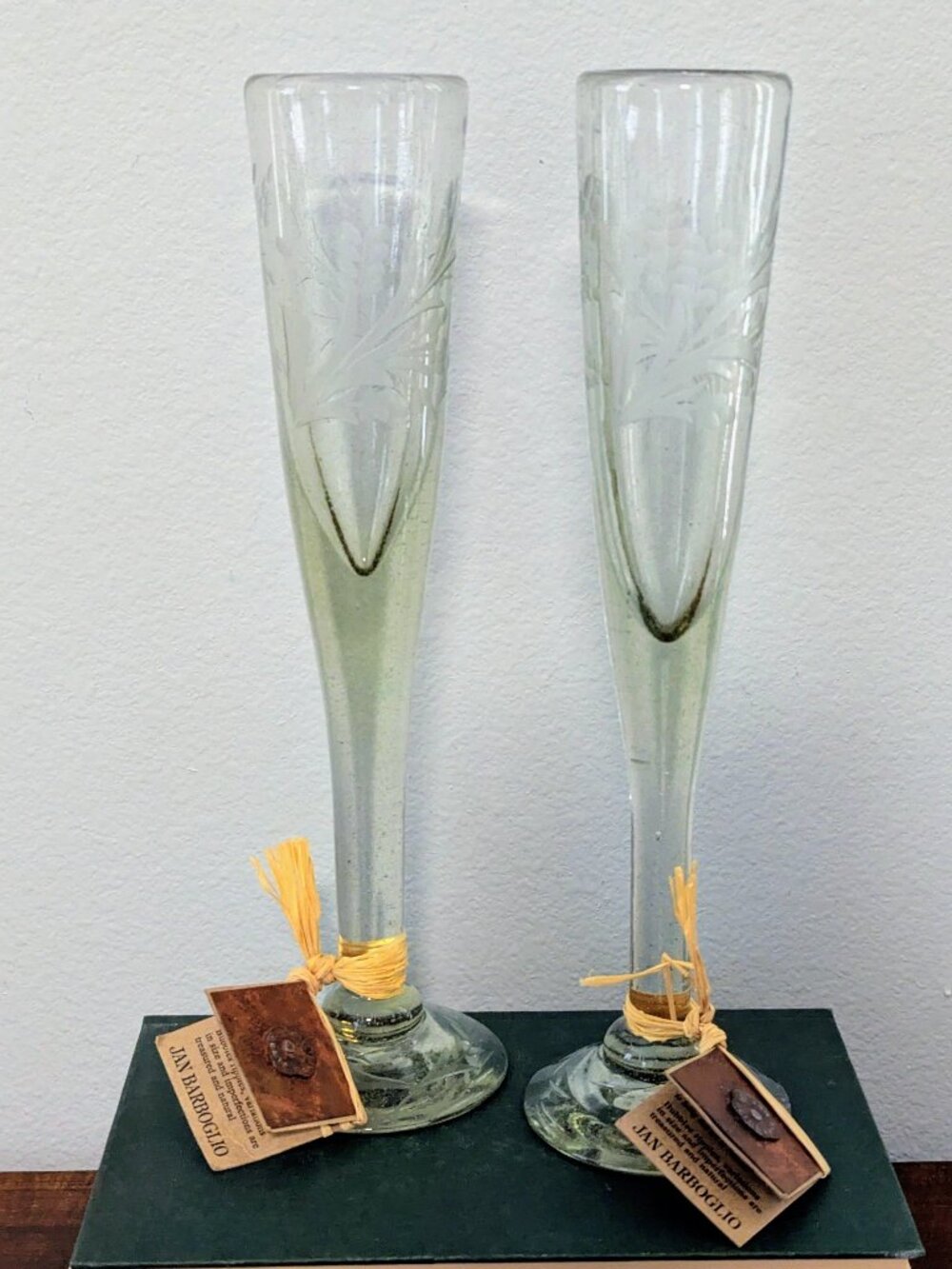 Pair of Jan Barboglio Etched Mouth-Blown Glass Champagne Flutes (Sell for $170 t